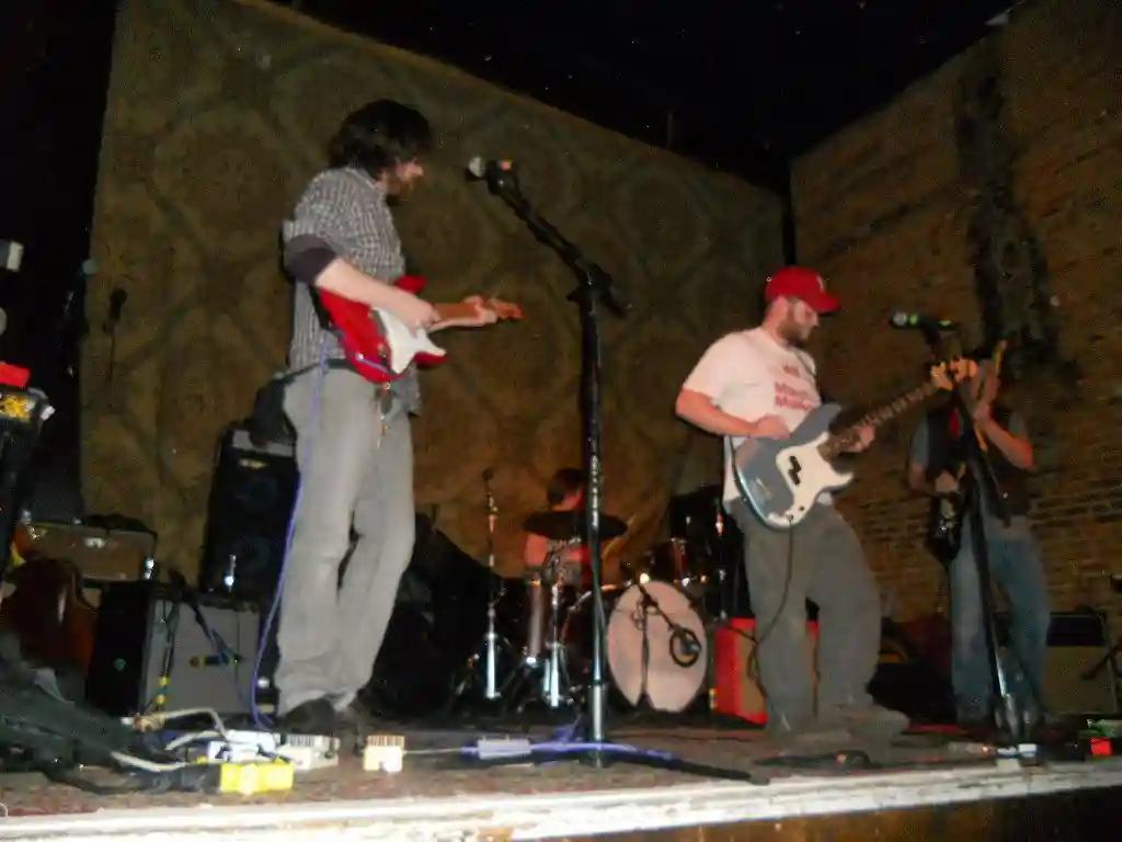 The band plays through a song